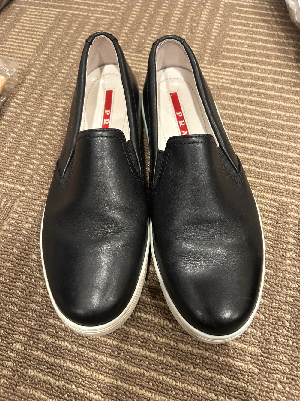 Prada Black Leather Slip-On Loafers with White Sole